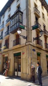 a man standing in front of a building at Pension Larrea in San Sebastián