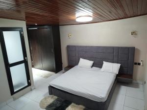 Postel nebo postele na pokoji v ubytování Résidence Dimi