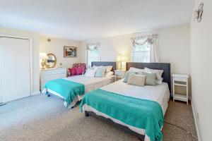 Ένα ή περισσότερα κρεβάτια σε δωμάτιο στο Falmouth Beach House