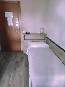 Postel nebo postele na pokoji v ubytování Hotel Salus