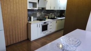 Η κουζίνα ή μικρή κουζίνα στο Cosy Apartment In the City Centre