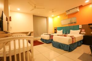 Ένα ή περισσότερα κρεβάτια σε δωμάτιο στο Hotel White Fields Hitec City, Hyderabad
