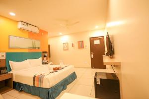 Ένα ή περισσότερα κρεβάτια σε δωμάτιο στο Hotel White Fields Hitec City, Hyderabad