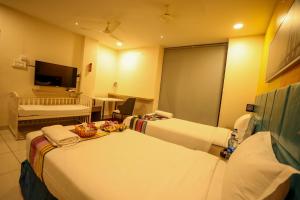 Ένα ή περισσότερα κρεβάτια σε δωμάτιο στο Hotel White Fields Hitec City, Hyderabad