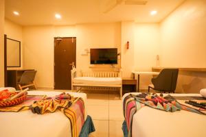 Ένα ή περισσότερα κρεβάτια σε δωμάτιο στο Hotel White Fields Hitec City, Hyderabad