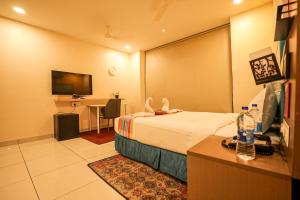 Ένα ή περισσότερα κρεβάτια σε δωμάτιο στο Hotel White Fields Hitec City, Hyderabad