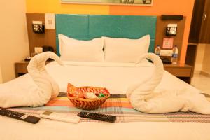Ένα ή περισσότερα κρεβάτια σε δωμάτιο στο Hotel White Fields Hitec City, Hyderabad