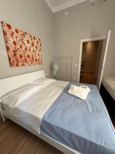 Postel nebo postele na pokoji v ubytování Redamare Suites + 2 fotografie
