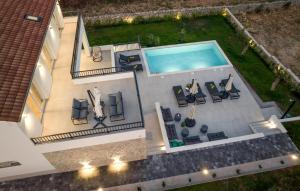 an aerial view of a house with a swimming pool at Pet Friendly Home In Sibenik in Šibenik