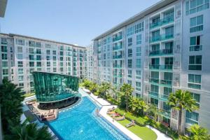 an aerial view of a building with a swimming pool at City Center Cozy in Pattaya