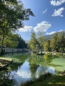 a view of a river with trees and a bridge at T2 lumineux l' Edelweiss pied du Prorel avec garage privé in Briançon