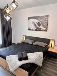 Postel nebo postele na pokoji v ubytování Bodega Apartments II