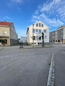 an empty street with buildings on the side of the road at Agaton Apartment in Andenes