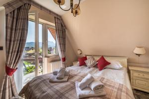 Posteľ alebo postele v izbe v ubytovaní Helan Family & SPA