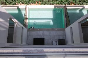 a swimming pool in a building with a pool at Azur Hotel in Athens