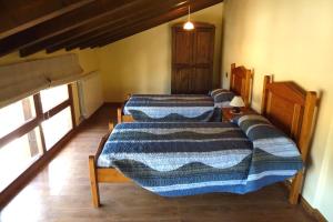 Una cama o camas en una habitación de Abadia de Cal Bessó