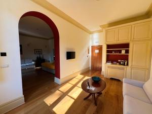 a living room with a couch and a table at Hotel Villa Casanova in Lucca