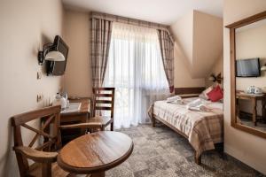Posteľ alebo postele v izbe v ubytovaní Helan Family & SPA