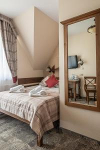 Posteľ alebo postele v izbe v ubytovaní Helan Family & SPA