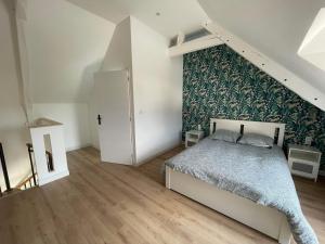 Postel nebo postele na pokoji v ubytování Le loft II