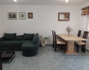 a living room with a couch and a table at Tina in Kolan
