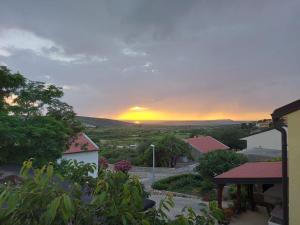 a view of a sunset from a house at Tina in Kolan