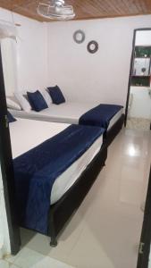 Ένα ή περισσότερα κρεβάτια σε δωμάτιο στο Cabaña San Nicolás +2 φωτογραφίες