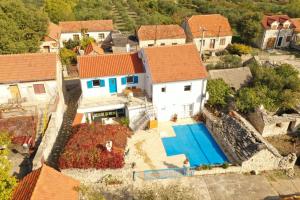 an aerial view of a house with a swimming pool at Skradin villa et studio in Dubravice