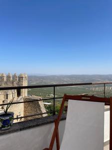 a view from the balcony of a building with a sign at La Casa Escondida in Sabiote