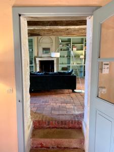 a living room with a couch and a fireplace at La Breteche du Perche in Saint-Germain-de-la-Coudre +86 photos