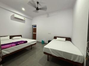 Hotel Raghunath Palace客房内的一张或多张床位