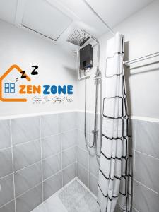 a shower in a bathroom with a sign on the wall at Zen Zone Studio Condo near Mactan Airport Cebu in Lapu Lapu City +12 photos