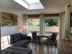 a living room with a couch and a table at Pension 19 in Pirna