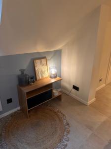 a room with a table with a picture on it at AS Pavan Saarlouis Ferienwohnung in Saarlouis