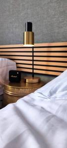 a bed with a lamp on a night stand next to it at Casa Las Plataneras in Santa Maria de Guia de Gran Canaria