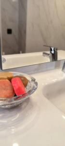 a plate of fruit sitting on a bathroom sink at Casa Las Plataneras in Santa Maria de Guia de Gran Canaria +22 photos