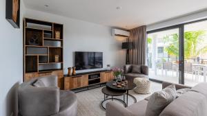 TV a/nebo společenská místnost v ubytování Luxe Breeze