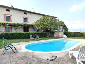 a swimming pool in front of a house at Yourte traditionnelle mongole in Marcoux