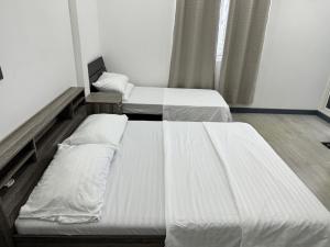 Postel nebo postele na pokoji v ubytování Noya inn fuvamulah