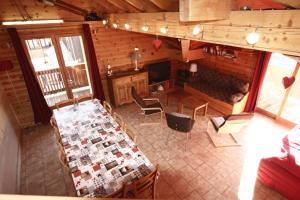 an overhead view of a room with a table and chairs at Le Pelvoux in Les Deux Alpes