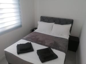 Postel nebo postele na pokoji v ubytování Marash apartman - stan na dan