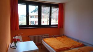 Postel nebo postele na pokoji v ubytování Hostel Waldblick