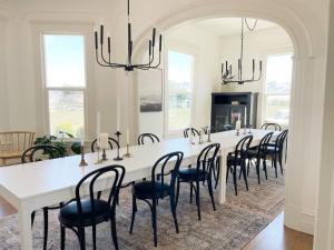 a large dining room with a white table and chairs at Edna Estate, Sleeps 17, Hot Tub in San Luis Obispo
