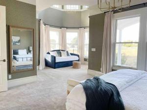 a large bedroom with a mirror and a bed at Edna Estate, Sleeps 17, Hot Tub in San Luis Obispo