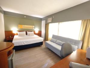 Ένα ή περισσότερα κρεβάτια σε δωμάτιο στο Flat King Vila Mariana (Apto 508)