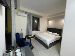 Postel nebo postele na pokoji v ubytování Regal Hotel