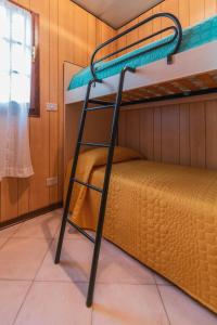 Postel nebo postele na pokoji v ubytování Camping Apuano