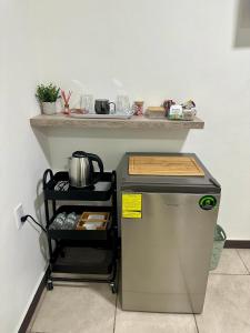 a small refrigerator with a counter on top of it at Casa Mia 901SM, habitación 2 in San Miguel