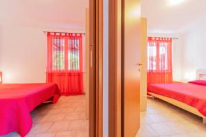 Postel nebo postele na pokoji v ubytování Camping Apuano