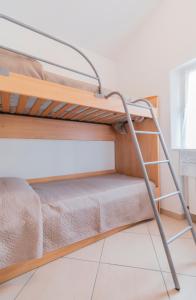 Postel nebo postele na pokoji v ubytování Camping Apuano